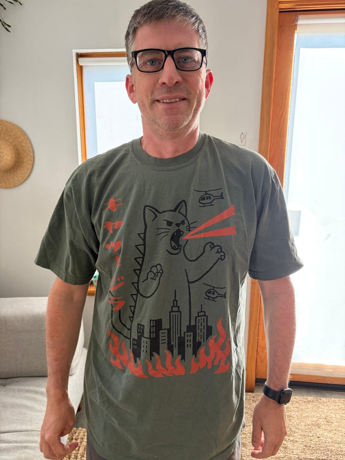 Gloriana W.'s husband in the Kyattojira tee she gave him