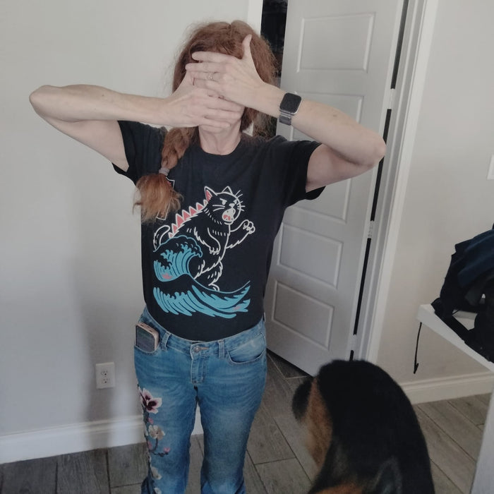 Mitch T.'s camera-shy wife hiding her face in her Wave of Kyattojira tee